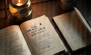 Open copies of J.G. Ballard's 'The Drowned World' laid out on a table, ready for discussion during a book club meeting.