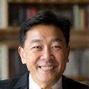 Portrait of James Teo, a friendly frequent customer with an intellectual smile